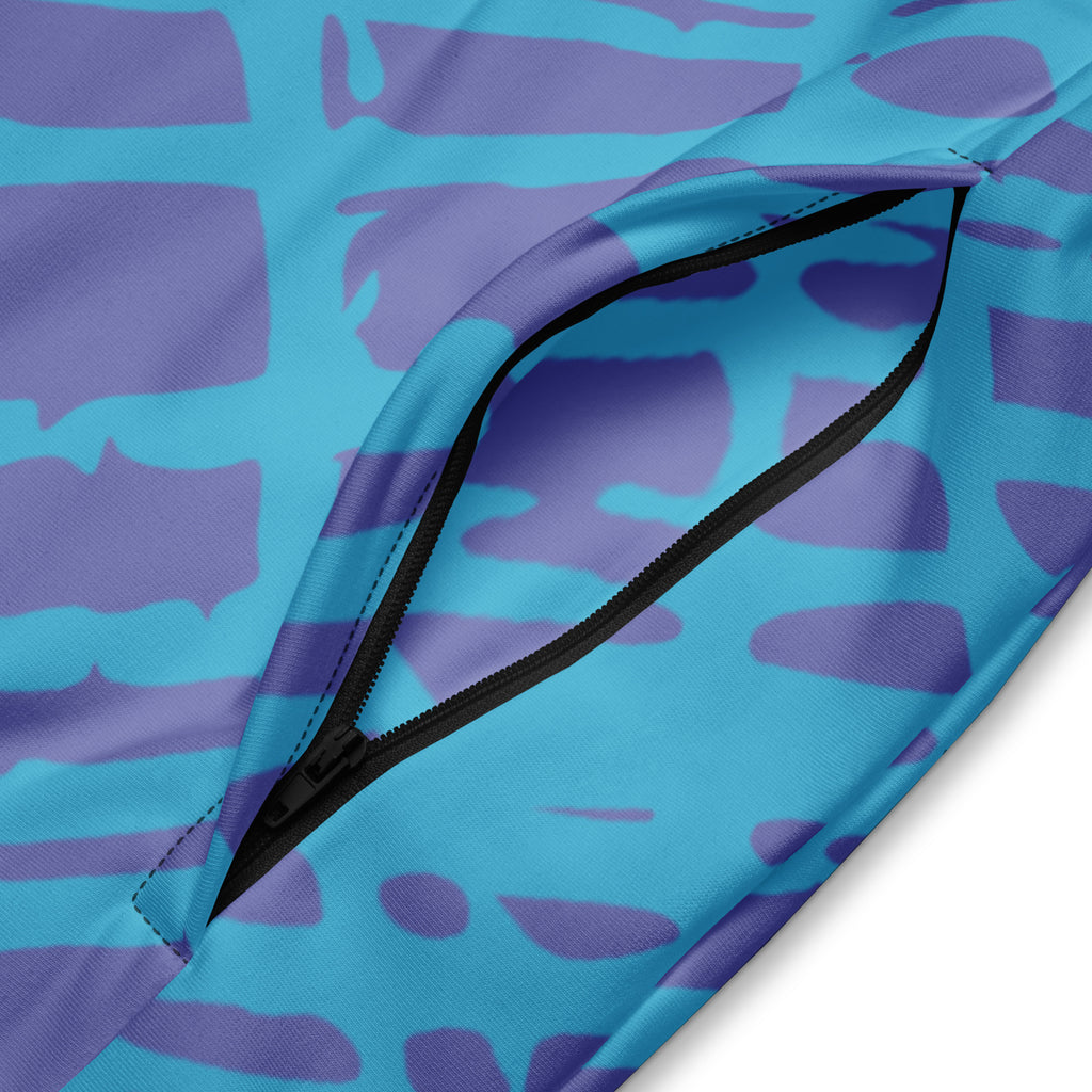 Herren-Trainingsjacke in Türkis und Lila mit einem abstrakten, gitterartigen Muster. Die Jacke hat einen Stehkragen und einen durchgehenden Reißverschluss.