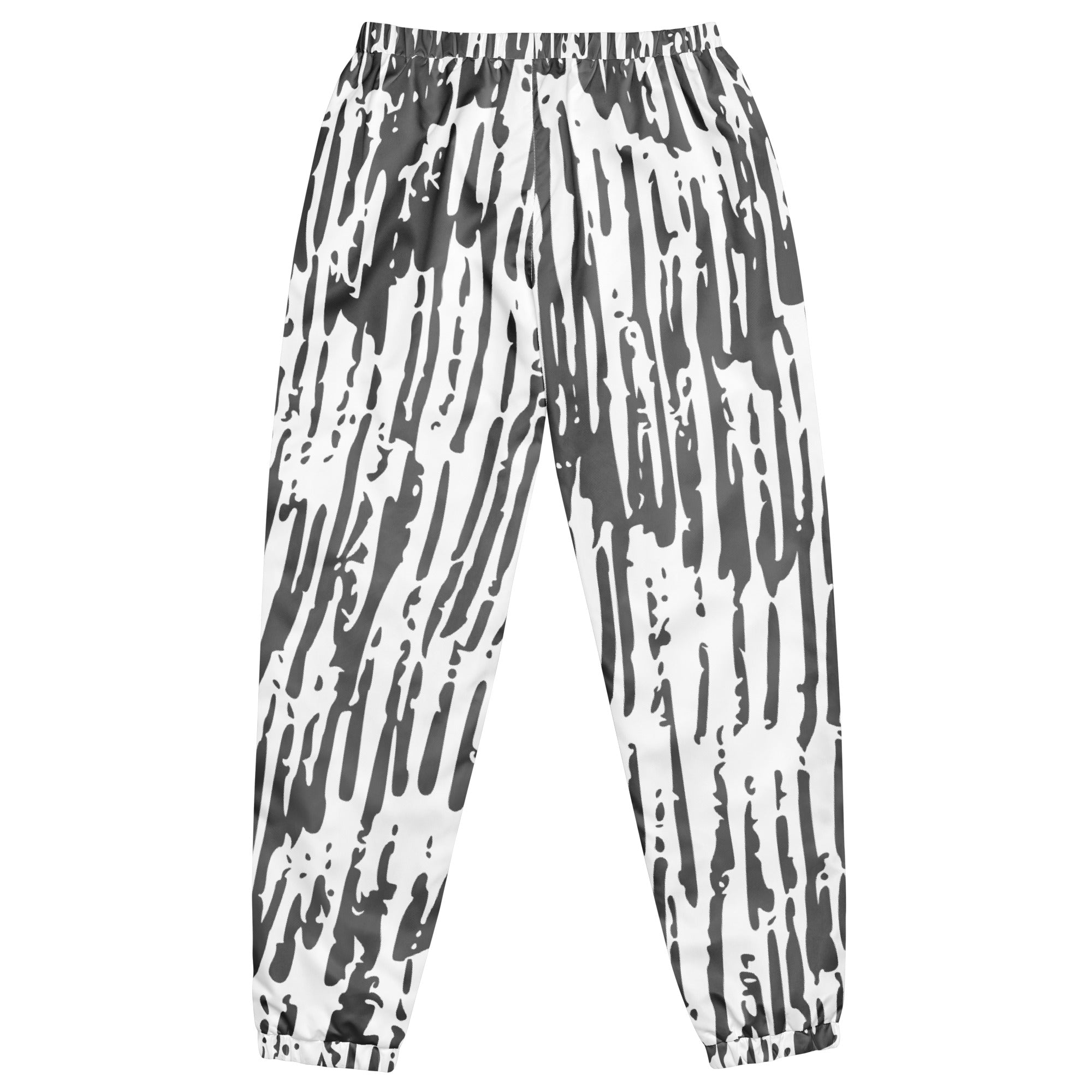 Schwarz-weiße Trainingshose mit einem abstrakten, vertikalen Strichmuster. Die Hose hat einen elastischen Bund und Bündchen an den Beinabschlüssen.