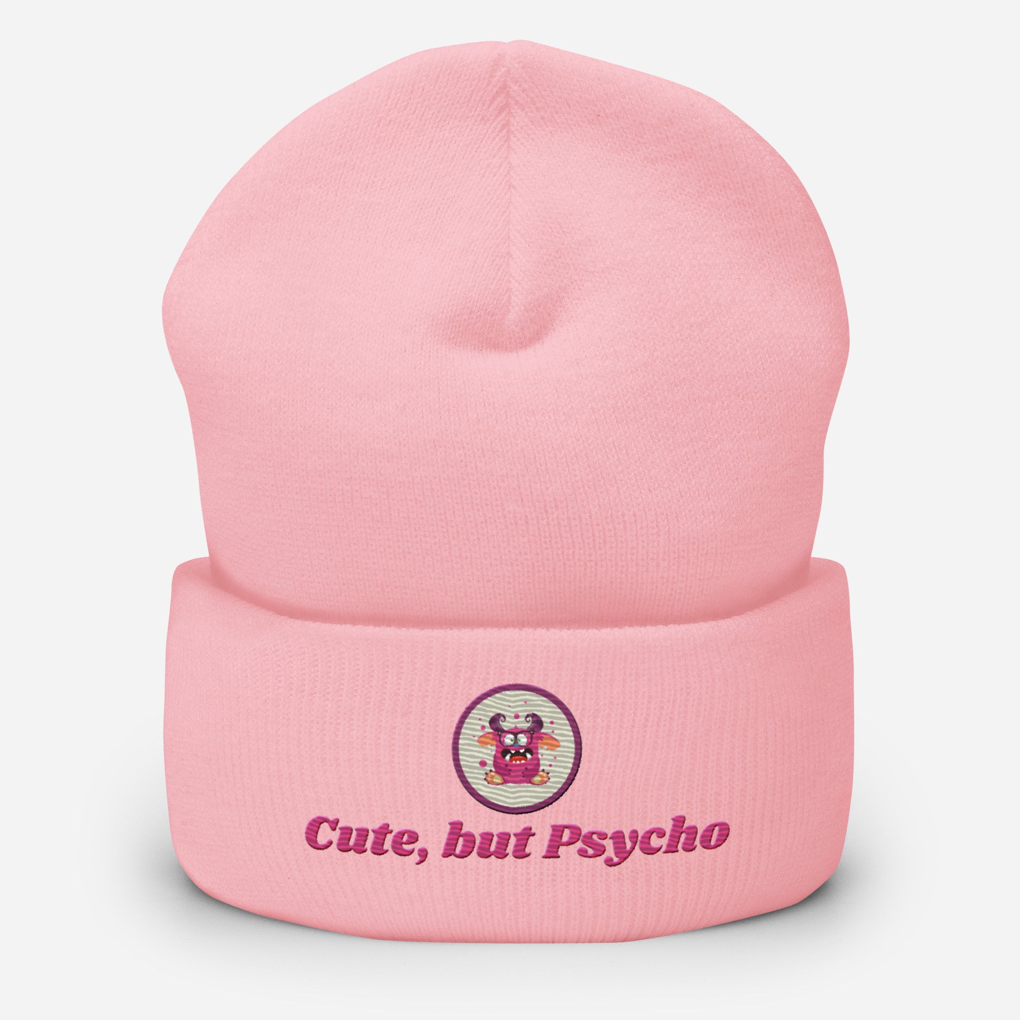 Eine Baby Rosa Cuffed Beanie mit aufgesticktem pinken monster gesicht in einem runden lila Rahmen auf der Vorderseite und "Cute but Psycho" Schrift darunter. Designed, by Just a Girl.