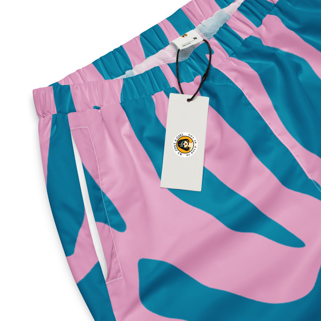 Damen Trainingshose mit pink-türkisem Animal Design. Mockup Hosenbund und Tasche mit Logo. Auffällige Streetwear für Frauen designed by, By Just a Girl.