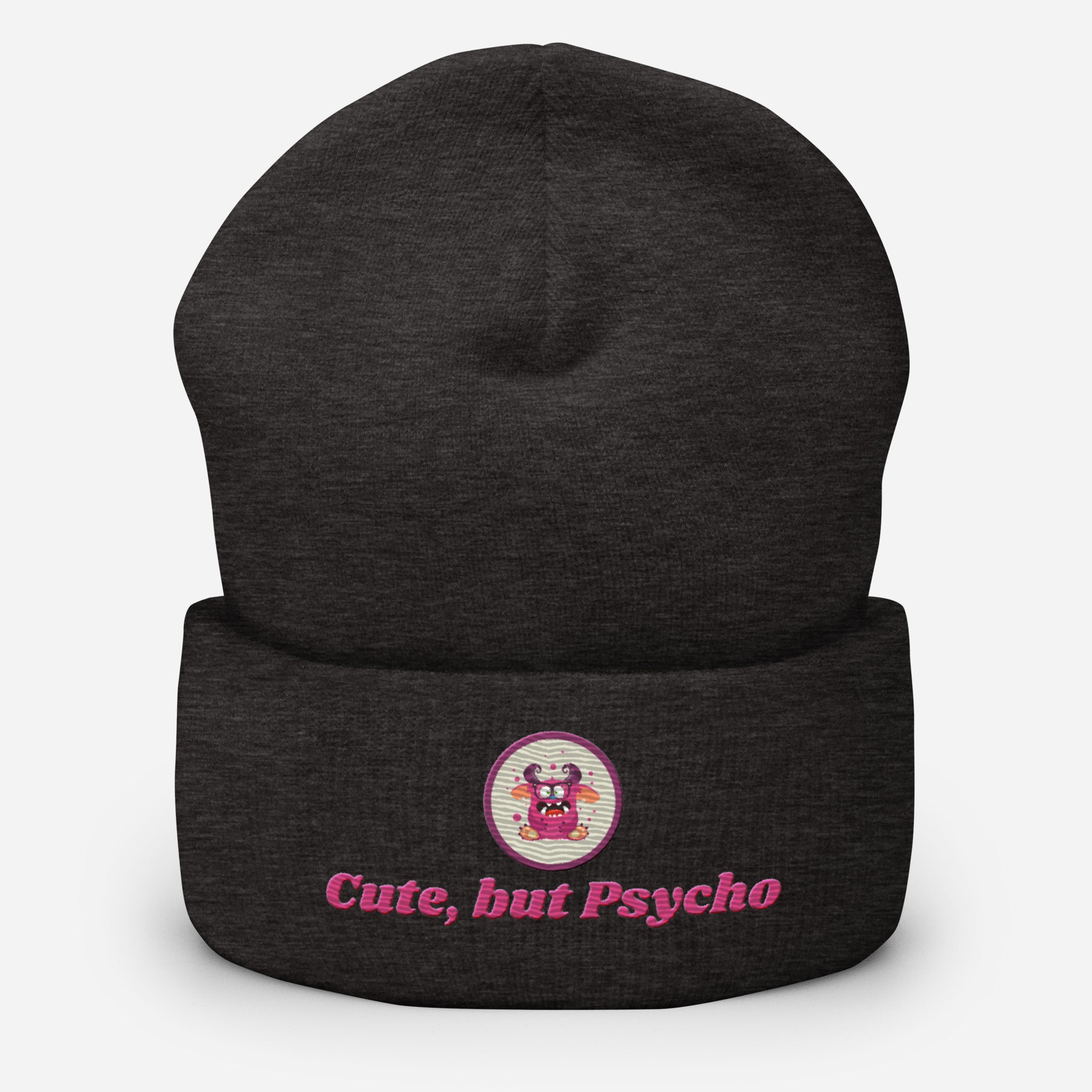 Eine Dunkelgraue Cuffed Beanie mit aufgesticktem pinken monster gesicht in einem runden lila Rahmen auf der Vorderseite und "Cute but Psycho" Schrift darunter. Designed, by Just a Girl.