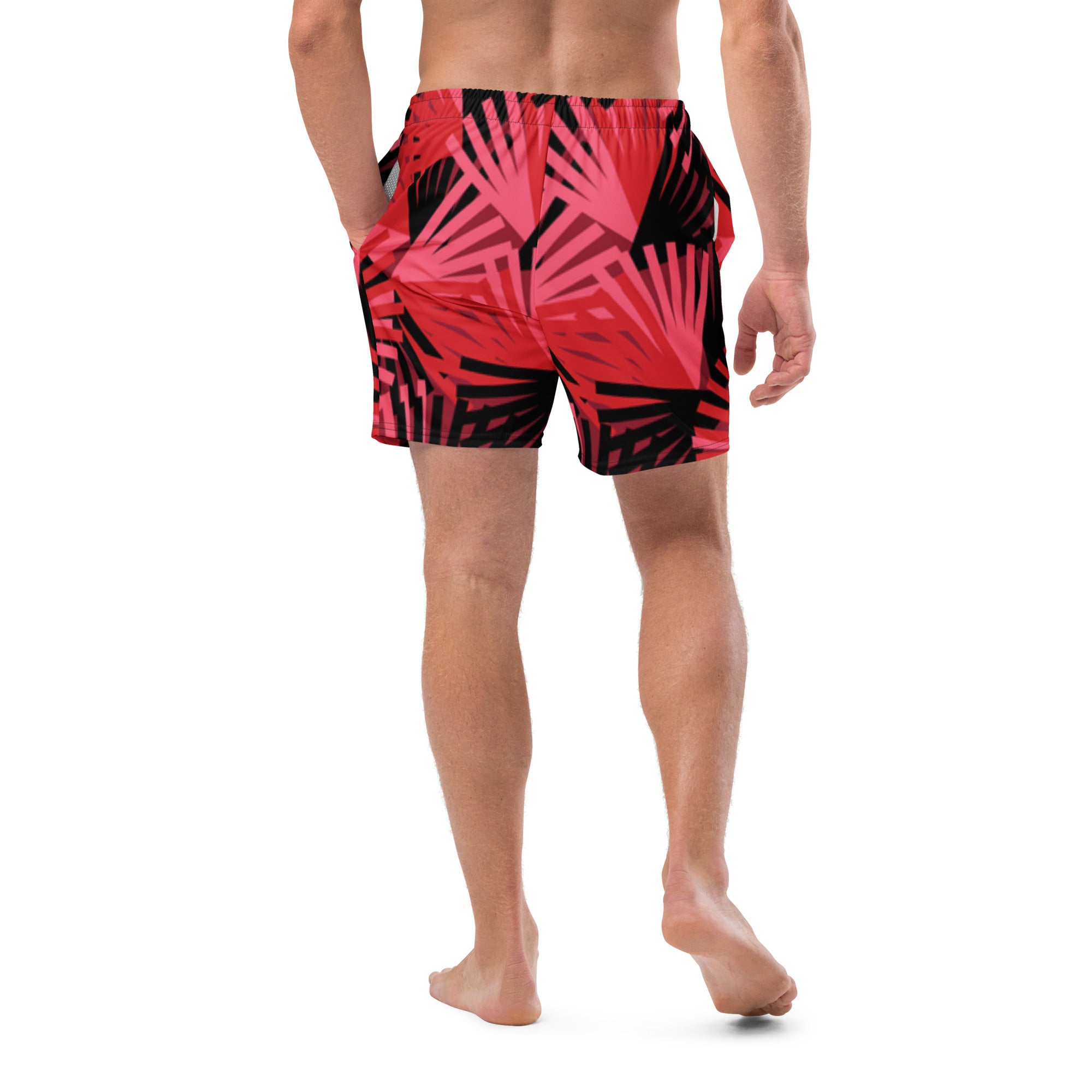 Eine Badeshorts mit einem Muster aus violetten Palmen und anderen stilisierten Pflanzen auf einem hellbeigen Hintergrund mit feinen, horizontalen Linien. Der Bund der Shorts ist elastisch.