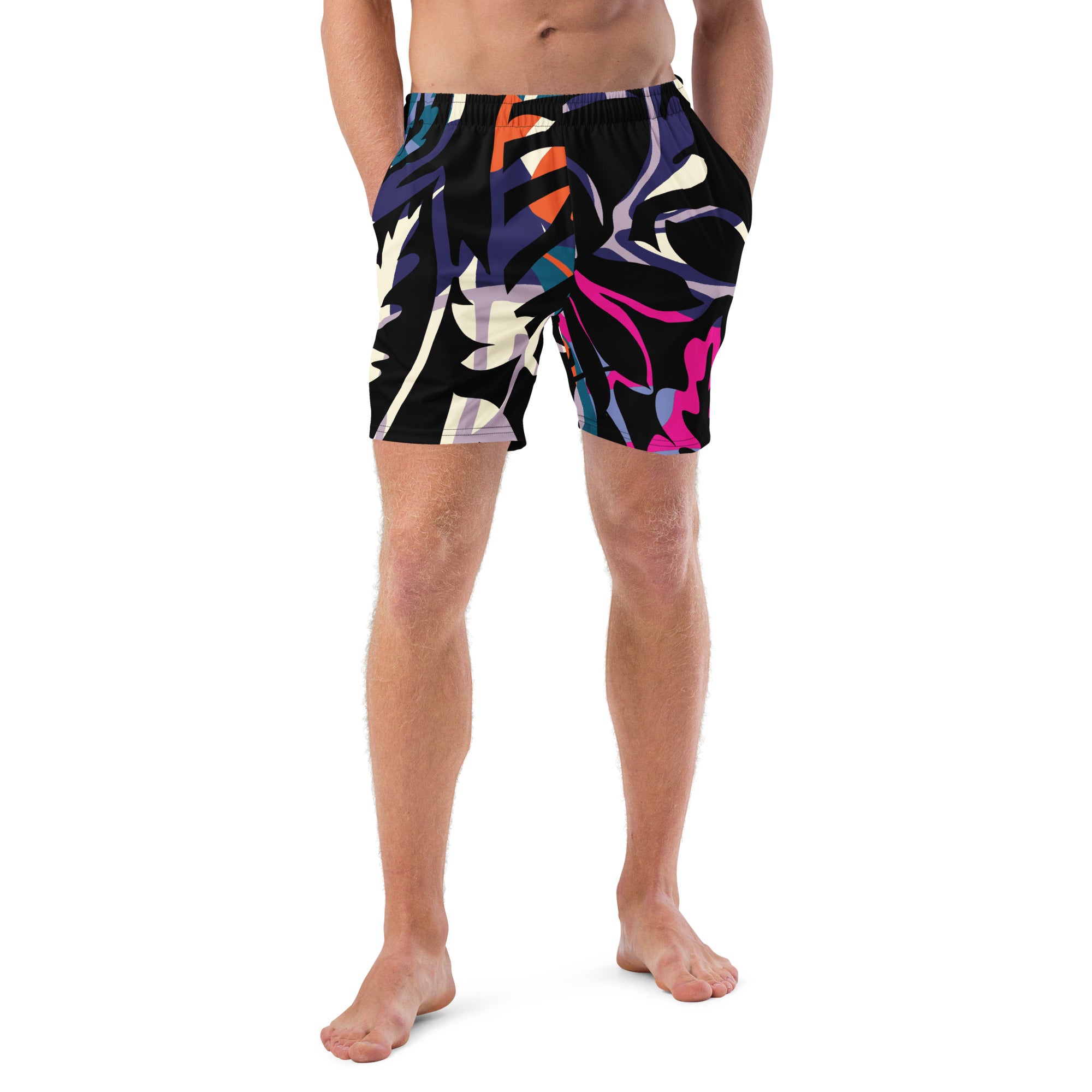 Eine Badeshorts mit einem abstrakten und lebhaften Muster aus stilisierten Blättern und Formen in leuchtenden Farben wie Violett, Orange, Türkis, Pink und Hellblau auf schwarzem Hintergrund. Der Bund der Shorts ist elastisch und schwarz.