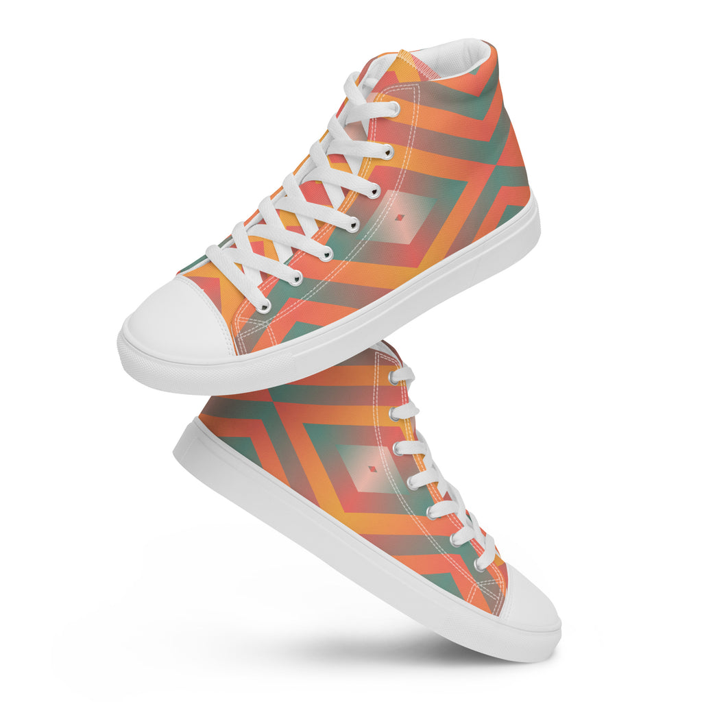 Zwei weiße High-Top-Sneaker mit einem leuchtenden geometrischen Muster in Orange, Türkisgrün und Gelb. Die Schnürsenkel und Zehenkappen sind weiß. Designed, by Just a Girl.