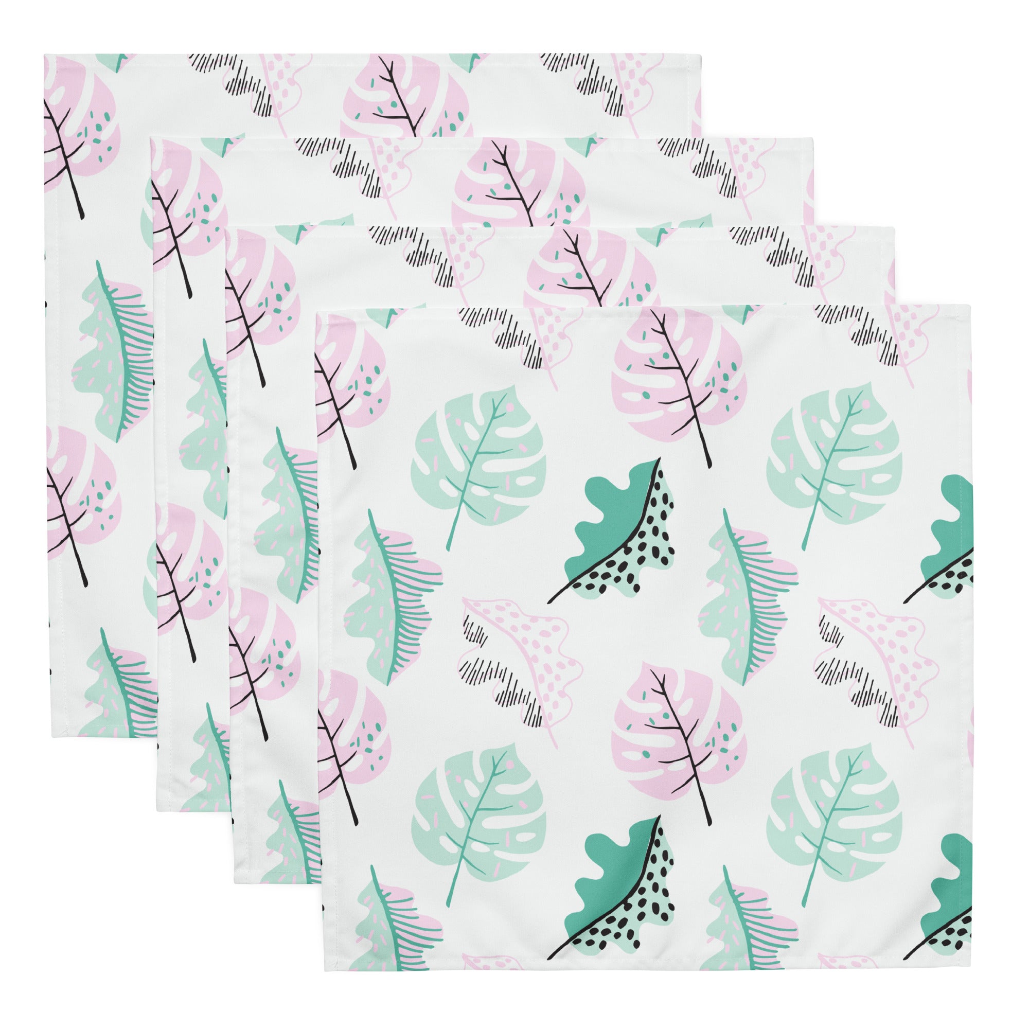 Ein Set aus vier Stoff-Servietten, freigestellt auf weißem Hintergrund. Der Hintergrund der Servietten ist weiß und zeigt ein modernes, abstraktes Muster aus Blättern in zarten Rosa- und Mintgrün-Tönen, ergänzt durch kleine schwarze Akzente.