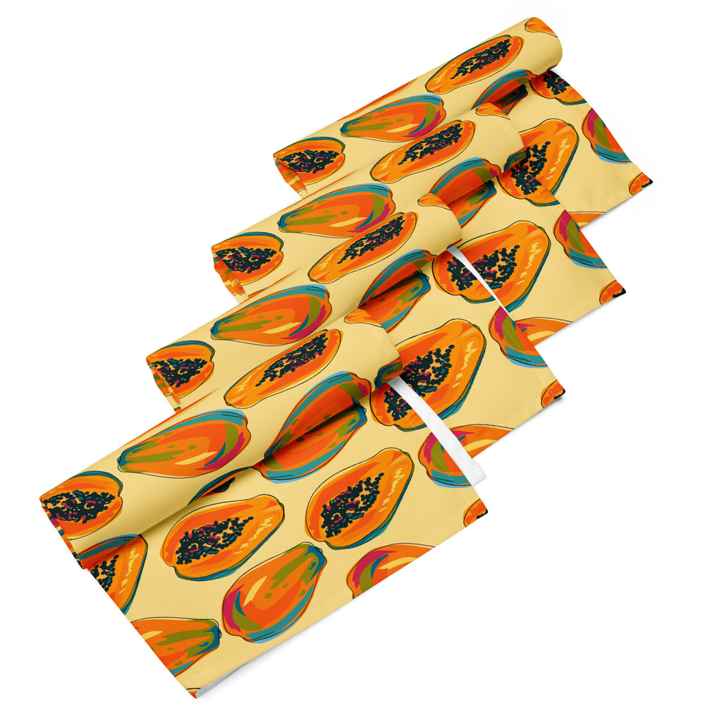 Ein Set aus vier gerollten Stoff-Servietten, freigestellt auf weißem Hintergrund. Das Muster zeigt eine Mischung aus ganzen und halben Papayas in leuchtenden Orange-, Rot- und Blautönen mit schwarzen Kernen. Der Hintergrund der Servietten ist einfarbig gelb.