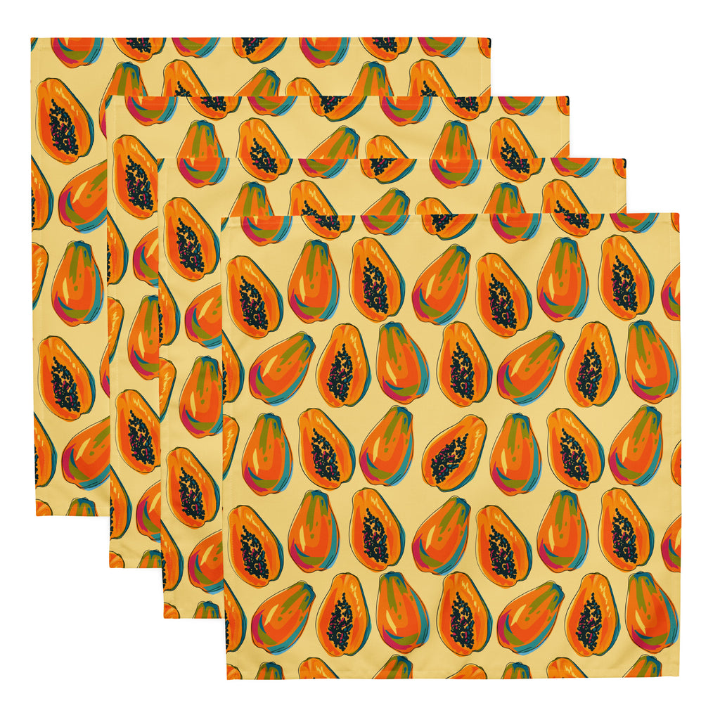 Ein Set aus vier  Stoff-Servietten, freigestellt auf weißem Hintergrund. Das Muster zeigt eine Mischung aus ganzen und halben Papayas in leuchtenden Orange-, Rot- und Blautönen mit schwarzen Kernen. Der Hintergrund der Servietten ist einfarbig gelb.