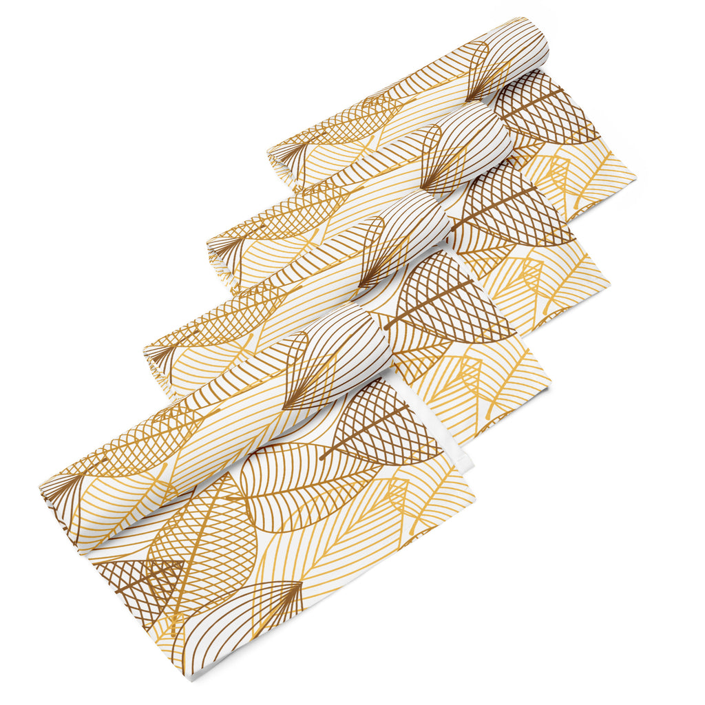 Ein 4er Set aus vier Stoff-Servietten, gerollt und freigestellt auf weißem Hintergrund. Das Muster zeigt stilisierte Blätter in verschiedenen Gold- und Brauntönen. Einige Blätter sind nur durch feine Linien gezeichnet, andere sind mit einem gekreuzten Muster gefüllt. 